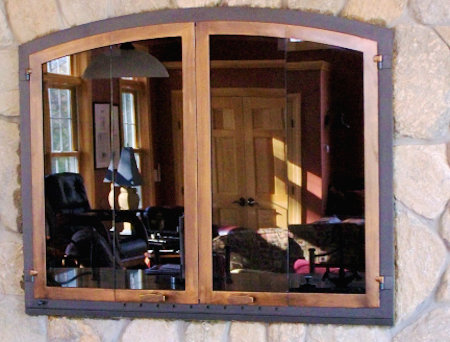 Nantucket Arch Black frame, antique copper Bottom mount vice bi fold doors, stand. smoke glass. Includes gate mesh spark screen  (Raised stone firebox, mortar install)